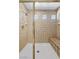 Shower with bench seat, tile surround, and glass doors at 358 Whispering Tree Ave, Las Vegas, NV 89183