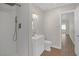 Modern bathroom features a walk-in shower and a white vanity at 416 Rossmoyne Ave, North Las Vegas, NV 89030