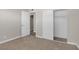 Bright bedroom features neutral paint, carpet, and large closet with sliding doors at 416 Rossmoyne Ave, North Las Vegas, NV 89030