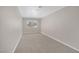 Neutral bedroom featuring soft carpet and natural light at 416 Rossmoyne Ave, North Las Vegas, NV 89030