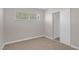Bedroom featuring plush carpet, a large window, and closet at 416 Rossmoyne Ave, North Las Vegas, NV 89030