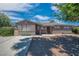 Charming single story home featuring brick veneer and desert landscaping at 416 Rossmoyne Ave, North Las Vegas, NV 89030