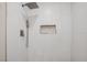 Modern shower featuring white tile, sleek fixtures, and recessed niche at 416 Rossmoyne Ave, North Las Vegas, NV 89030