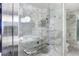 Luxurious marble bathroom features a glass-enclosed shower and modern fixtures at 4381 W Flamingo Rd # 2122, Las Vegas, NV 89103