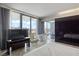 This luxurious bedroom features floor-to-ceiling windows with city views and a standalone soaking tub at 4381 W Flamingo Rd # 2122, Las Vegas, NV 89103