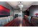 Contemporary dining area featuring a stainless kitchen, unique lighting, and modern artwork at 4381 W Flamingo Rd # 2122, Las Vegas, NV 89103