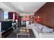 Inviting living room boasts modern fireplace, comfortable seating, and sleek bar area for relaxation at 4381 W Flamingo Rd # 2122, Las Vegas, NV 89103