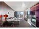 Contemporary living room boasts stylish decor, a fireplace, and a great view of the city skyline at 4381 W Flamingo Rd # 2122, Las Vegas, NV 89103