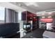 Modern living room features a fireplace and city views, plus an integrated bar and seating area at 4381 W Flamingo Rd # 2122, Las Vegas, NV 89103