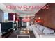 Contemporary living room with a sleek fireplace, kitchen bar and city views at 4381 W Flamingo Rd # 2122, Las Vegas, NV 89103