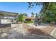 Spacious backyard features desert landscaping, a covered carport, and a cozy outdoor dining area at 4409 W Red Coach Ave, North Las Vegas, NV 89031