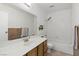 Bathroom boasts an expansive mirror and bright lighting, paired with a shower/tub combo at 4409 W Red Coach Ave, North Las Vegas, NV 89031