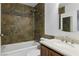 Bathroom features a tiled shower and tub, with modern fixtures and ample space at 4409 W Red Coach Ave, North Las Vegas, NV 89031
