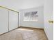 Bedroom with tile floors, closet, and a sunny window at 4409 W Red Coach Ave, North Las Vegas, NV 89031