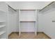 Spacious walk-in closet features ample shelving and hanging space for optimal organization at 4409 W Red Coach Ave, North Las Vegas, NV 89031