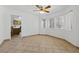Open dining area with tiled flooring, natural light, and a view into the adjacent kitchen at 4409 W Red Coach Ave, North Las Vegas, NV 89031