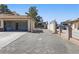 Long driveway leading to a spacious garage and additional carport, perfect for multiple vehicles at 4409 W Red Coach Ave, North Las Vegas, NV 89031