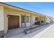 Inviting front porch with brick accents, a covered entryway, and a glimpse of the attached garage at 4409 W Red Coach Ave, North Las Vegas, NV 89031