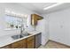 Bright kitchen with plenty of storage space, and a garden window above the sink at 4409 W Red Coach Ave, North Las Vegas, NV 89031