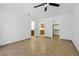 Spacious primary bedroom with tile floors and connecting bathroom and closet at 4409 W Red Coach Ave, North Las Vegas, NV 89031