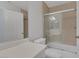 Bright bathroom featuring a single vanity, toilet, and tiled shower-tub combo at 4619 Reliant St, North Las Vegas, NV 89031