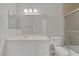 Bathroom with single vanity, toilet, and tiled shower-tub combo at 4619 Reliant St, North Las Vegas, NV 89031