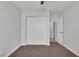 Bedroom featuring carpet flooring, closet with sliding doors, and access to an additional room at 4619 Reliant St, North Las Vegas, NV 89031