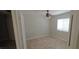 Cozy bedroom with neutral walls, a ceiling fan, and a window at 4619 Reliant St, North Las Vegas, NV 89031