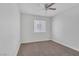 Bright bedroom with carpet flooring, a ceiling fan, and a window with blinds at 4619 Reliant St, North Las Vegas, NV 89031