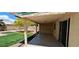 Covered patio with tile flooring, providing access to backyard and desert landscaping at 4619 Reliant St, North Las Vegas, NV 89031