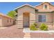 Charming single-story home with a welcoming front entrance and desert landscaping at 4619 Reliant St, North Las Vegas, NV 89031