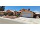 Street view of the home's exterior with tan stucco, tile roof, and low maintenance landscaping at 4619 Reliant St, North Las Vegas, NV 89031