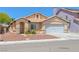Charming single-story home with well-maintained landscaping and a spacious two-car garage at 4619 Reliant St, North Las Vegas, NV 89031
