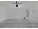 Spacious garage with water heater, bright lighting, and door leading to the side yard at 4619 Reliant St, North Las Vegas, NV 89031