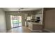 Eat in kitchen with white cabinets, stainless steel appliances, and sliding glass door to backyard at 4619 Reliant St, North Las Vegas, NV 89031