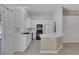 Beautiful kitchen with white cabinets, black appliances, and a functional breakfast bar at 4619 Reliant St, North Las Vegas, NV 89031