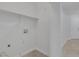 Clean laundry room with tile flooring and built in shelving offers great storage options at 4619 Reliant St, North Las Vegas, NV 89031