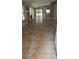 Open living space with tile flooring and natural light flowing from the sliding glass door at 4619 Reliant St, North Las Vegas, NV 89031
