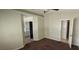 Main bedroom with carpet, ceiling fan, and an attached bathroom at 4619 Reliant St, North Las Vegas, NV 89031