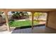 Covered patio offering a view of the backyard with artificial turf and desert landscaping at 4619 Reliant St, North Las Vegas, NV 89031