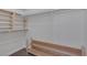Spacious walk-in closet with built-in wooden shelving and ample storage space for clothes and accessories at 4619 Reliant St, North Las Vegas, NV 89031