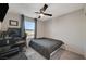 Cozy bedroom with a ceiling fan, a large window, and a comfortable bed at 4977 Birchland Manor Ave, Las Vegas, NV 89139