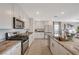 Modern kitchen features granite counters, stainless appliances, and white cabinets at 4977 Birchland Manor Ave, Las Vegas, NV 89139