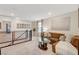 Loft with lounge area, railing and neutral color scheme and natural light at 4977 Birchland Manor Ave, Las Vegas, NV 89139