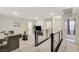Upstairs loft area includes comfortable seating, a tv, and neutral carpeting at 4977 Birchland Manor Ave, Las Vegas, NV 89139