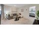 Upstairs loft features comfortable seating, artwork, and access to other bedrooms at 4977 Birchland Manor Ave, Las Vegas, NV 89139