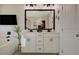 Bathroom showcasing a double sink vanity with a soaking tub and a walk in shower at 4977 Birchland Manor Ave, Las Vegas, NV 89139