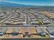 Wide aerial view of the community showcases the neighborhood layout and mountain views in the distance at 5460 Chippewa, Pahrump, NV 89061