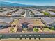 Aerial view of the property features a well-kept lawn, a backyard patio and desert landscaping at 5460 Chippewa, Pahrump, NV 89061