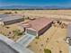 Aerial view of a single-Gathering home showing desert landscaping, two-car garage and mountain views at 5460 Chippewa, Pahrump, NV 89061